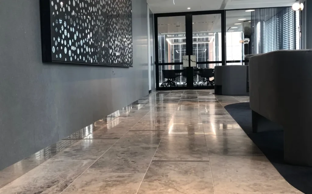 Commercial-lobby-with-stone-floor-and-reception-wall-1024x638